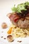 Steak with bacon and linguine. Conceptual image