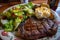 steak, baked potato, and salad for classic comfort food meal