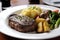 steak, baked potato, and vegetable medley on white plate