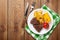 Steak with grilled potato, corn, salad and tomato