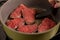 steak meat in the process of cooking. Frying pieces of beef in a frying pan.