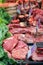 Steak and other meats at butchers counter.