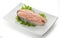 Steak of salmon with fresh lettuce