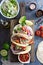 Steak tacos with sliced meet, salad and tomato salsa