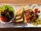 Steak tartare served with side dishes, toast and salad