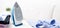 Steam blue iron on ironing board