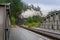 Steam engine locomotive train ride on narrow gauge track on rain bridge