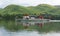 Steam ferry with holidaymakers and tourists Ullswater Lake District with green hills