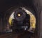 Steam locomotive enters tunnel