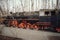 Steam locomotive parked at a terminal station. Historical railroad from 1940