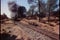 Steam locomotive passing through countryside