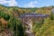 Steam locomotive train crossing the Takiya bridge on Tadami line.