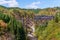 Steam locomotive train crossing the Takiya bridge on Tadami line.