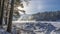 Steam rises above the thaw in the frozen river.