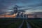 The Steam Rises From The Cooling Towers At Sunset