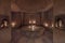 Steam room covered in white marble with candles and ornacines
