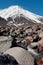 A steam running down from the snowy head of Koryaksky Volcano