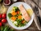 Steam salmon and vegetables, Paleo, keto, fodmap diet. White plate on old rustic wooden table, top view