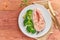 Steam salmon and vegetables, paleo, keto, fodmap diet. White plate on rustic wooden table, top view, copy space