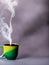 Steam and Savor: Green Porcelain Cup with Hot Coffee