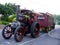 a steam traction engine towing a authentic caravan and trailer