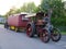 a steam traction engine towing a authentic caravan and trailer