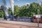 A steam train, bellowing steam and smoke at the aviemore train station