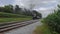 Steam Train Pulling out of Picnic Area Along Amish Farmlands