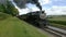 Steam Train Pulling out of Picnic Area Along Amish Farmlands