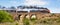 Steam Train Travelling Over Old Bluestone Bridge, Sunbury, Victoria, Australia, October 2018