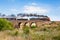 Steam Train Travelling Over Old Bluestone Bridge, Sunbury, Victoria, Australia, October 2018