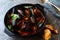 Steamed black mussels in pan