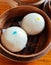 Steamed Buns. Dimsum in the steam basket. food on wooden table.