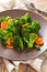 Steamed carrots and broccoli .