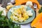 Steamed cauliflower with sauce and pumpkin and greenery
