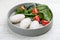 Steamed cutlets of three kinds of white meat with fresh spinach and tomatoes