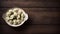 Steamed Dumplings in a Bowl on a Wooden Table Top View, Copy Space