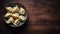 Steamed Dumplings in a Bowl on a Wooden Table Top View, Copy Space