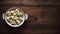 Steamed Dumplings in a Bowl on a Wooden Table Top View, Copy Space