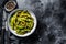 Steamed Edamame Bean, Green Soybean in a pan, East Asian Cuisine. White background. Top view. Copy space