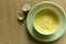 Steamed eggs in a bowl on wooden floor