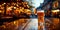 A steamed glass of fresh beer on a wooden table against the background of a street cafe and garland lights