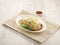 Steamed Kampong Chicken in Canton Style Noodle with chopsticks served in a dish isolated on mat side view on grey background