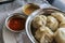 Steamed momos (dumplings) and dipping sauce