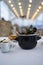 Steamed mussels in white wine sauce in a black pot on the table, bread , caviar and sauce