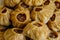 Steamed national Mongolian food dumpling Buuz filled with minced beef, white plate, wooden table, Close up east Siberian Buryats