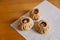 Steamed national Mongolian food dumpling Buuz filled with minced beef, white serviette, wooden table, Close up east Siberian