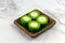 Steamed pandan-flavoured kuih with a creamy center filling made of coconut cream - Kuih Nona Manis