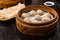 Steamed Xiao Long Bao Soup Dumplings in The Bamboo Basket. Served in Restaurant in Taipei, Taiwan