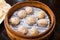 Steamed Xiao Long Bao Soup Dumplings in The Bamboo Basket. Served in Restaurant in Taipei, Taiwan